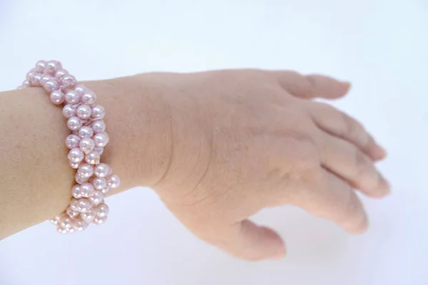 Beautiful Bracelet Made Pink Pearls Elastic Band Scrunchie Female Hand — Stockfoto