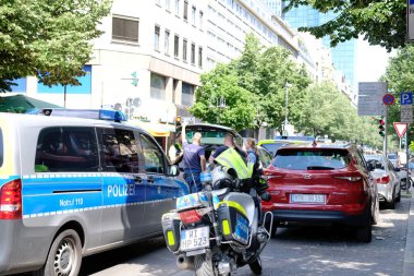 typical german police cars, motorbikes on streets of germany, frankfurt am main law enforcement officers guarding order on vehicles, demonstrations, rallies, investigating crimes, Frankfurt - May 2022