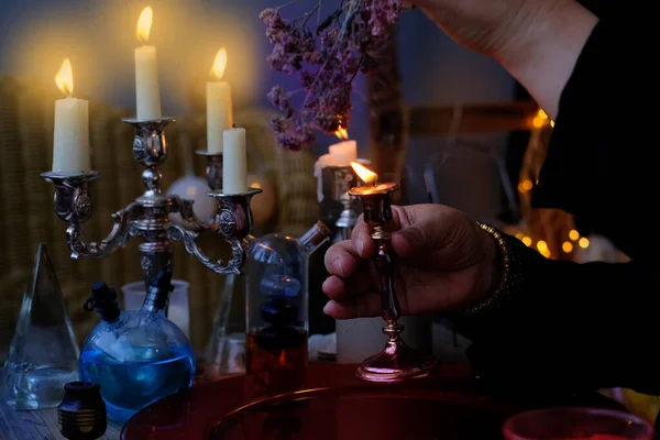 Female Witch Holds Candle Candlestick Her Hands Conjures Dark Room — Stok fotoğraf