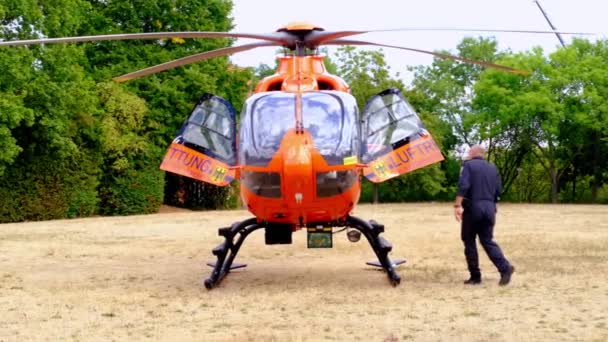 Modern Red Paramedic Ambulance Emergency Aircraft Germany Helipad Medical Helicopter — стокове відео