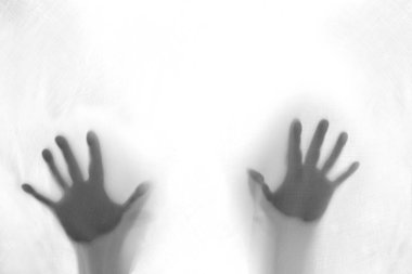 eerie blurry hands of people, ghost as if they have been trapped behind glass, fabric, wrap, spirit trying to reach out from afterlife, concept of violence, nightmares, halloween horror, friday 13th