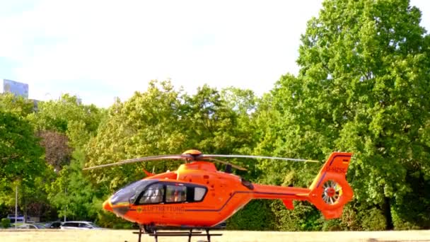 Modern Red Paramedic Ambulance Emergency Aircraft Germany Helipad Medical Helicopter — Vídeos de Stock