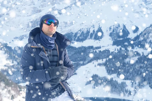 young man wearing sunglasses, mountain hiker admiring mountain winter landscape, Sports Concept, Healthy Lifestyle, Winter Activity, beautiful winter natural landscape, walks in winter white forest