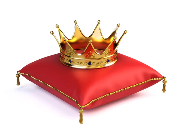 Guld krona på röd kudde — Stockfoto
