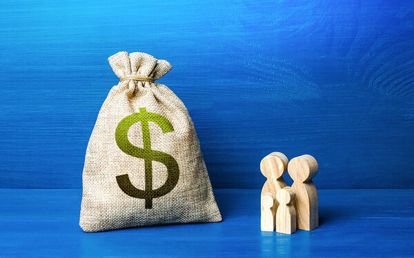 Family figurines and dollar money bag. Social policy, family budget. Investment in human capital. Favorable conditions for population growth. Medicine and demography. Income and expenses