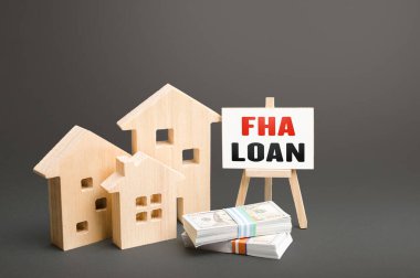 Konut binaları ve FHA kredisiyle sehpa. İpotek, Federal Konut İdaresi Kredisi tarafından sigortalanmış. Düşük kredi puanı olan borçlular için uygun fiyatlı bir finansal araç. Yüksek temerrüt riski