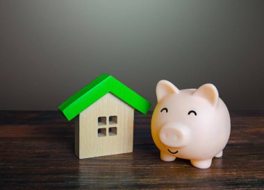 Evin yakınındaki kumbarayı memnun ettim. Düşük maliyet ve yüksek enerji verimliliği. Yeşil teknolojileri barındırmak. Özerklik ve kendi kendine yetme. Ekonomik ekonomik konut.