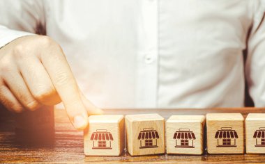 İşadamları yeni bir mağaza açıyor. Bir priz ekliyorum. Bayilik yönetimi. Yatırım. Ticaret ağının büyümesi ve gelişimi. Yeni mevcudiyet noktaları. İş şehri altyapısının genişletilmesi.