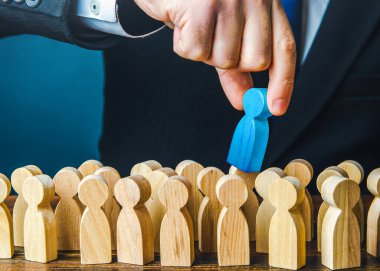 Employer chooses a blue person from the crowd of job candidates. Selects the best candidate for the job. Recruit new workers. Education and skill training courses. Human resources, labor market.