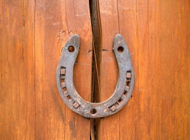 Horseshoe on a wooden crack. The concept of good luck and safety. Protect from destruction, failures and misfortunes. Superstitions and beliefs. Problem solution. Strengthening and security. Insurance