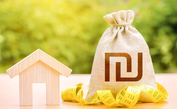 House and israeli shekel money bag. Property valuation. Mortgage loan calculation. Real estate appraisal. Budgeting. Rental income. Cost of home services. Building maintenance. Energy efficiency