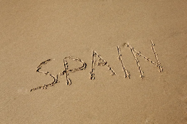 Spanien in den Sand am Strand geschrieben — Stockfoto