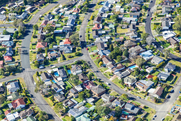Aerial view of typical older Australian suburb featuring mainly detached single housing with back  yard space.