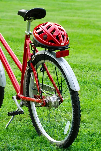 Red bike and a helmet — Zdjęcie stockowe