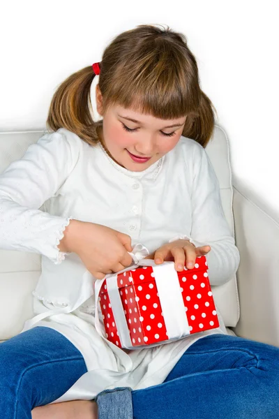 Happy little girl opening a present — Stock Photo, Image