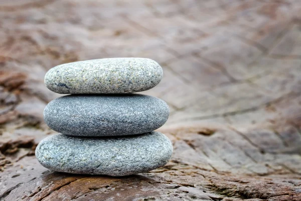 Zen stones on old driftwood — Stock Photo, Image