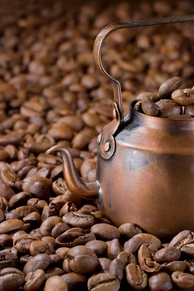 Rustic coffee pot with coffee beans