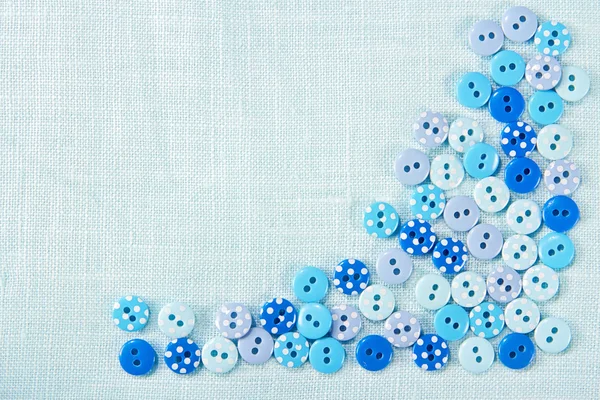 Blue buttons on linen - sewing background — Stock Photo, Image