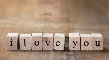 Message I love you spelled in wooden blocks