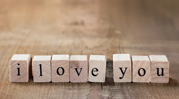 Message I love you spelled in wooden blocks — Stock Photo, Image