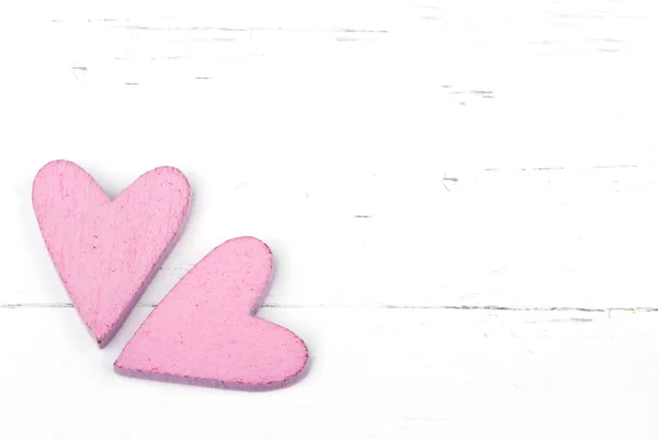 Två rosa hjärtan på vit bakgrund — Stockfoto