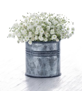 Bouquet of white gypsophila on wooden background clipart