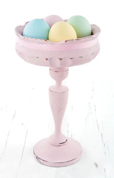 Vintage pastel color easter eggs in old vase — Stock Photo, Image