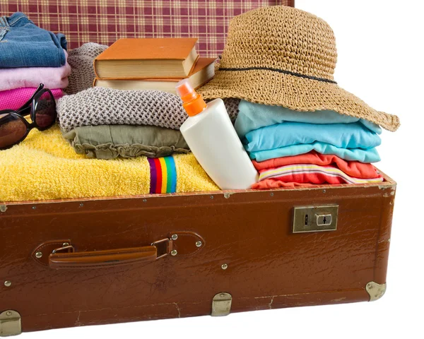 Old vintage suitcase packed with clothes and vacation accessorie — Stock Photo, Image