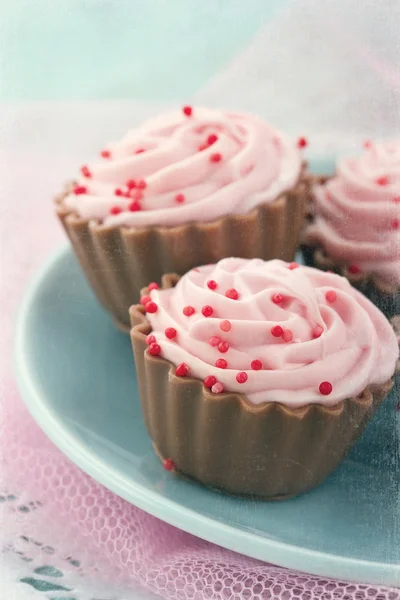 Vintage editing on pink chocolate cupcakes — Stock Photo, Image