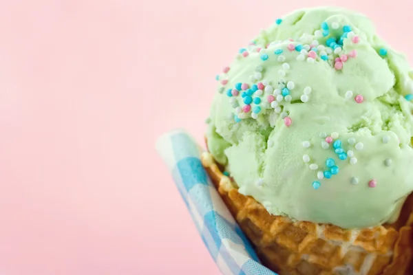Green pear ice cream in a cone — Stock Photo, Image