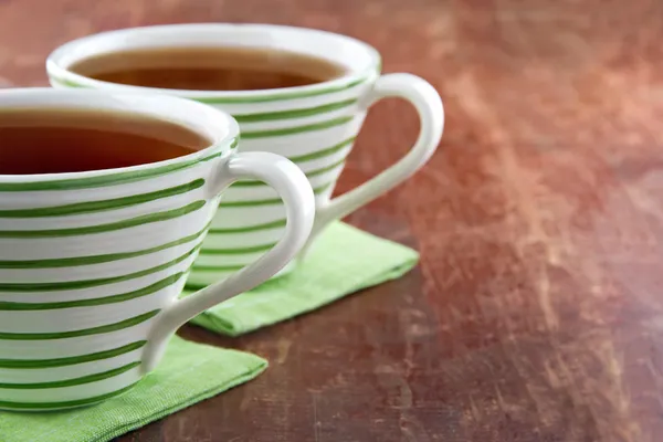 Two cups of tea on wooden background — Stock Photo, Image