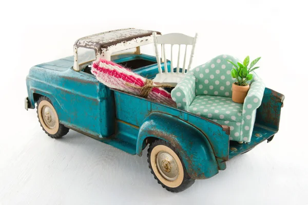 Green toy truck for moving houses — Stock Photo, Image