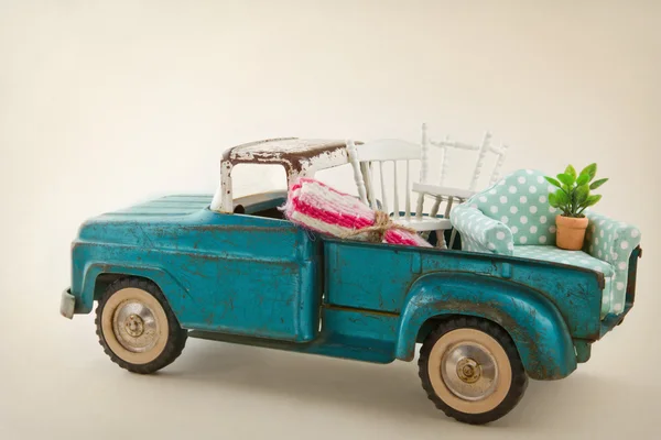 Toy truck packed with furniture — Stock Photo, Image