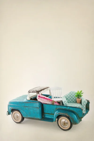 Toy truck packed with colorful furniture — Stock Photo, Image