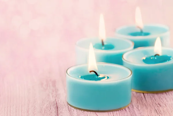 Blue burning candles — Stock Photo, Image