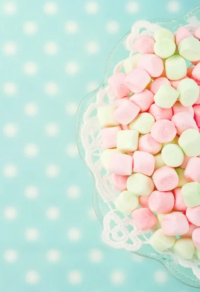 Pink marshmallows on blue background — Stock Photo, Image