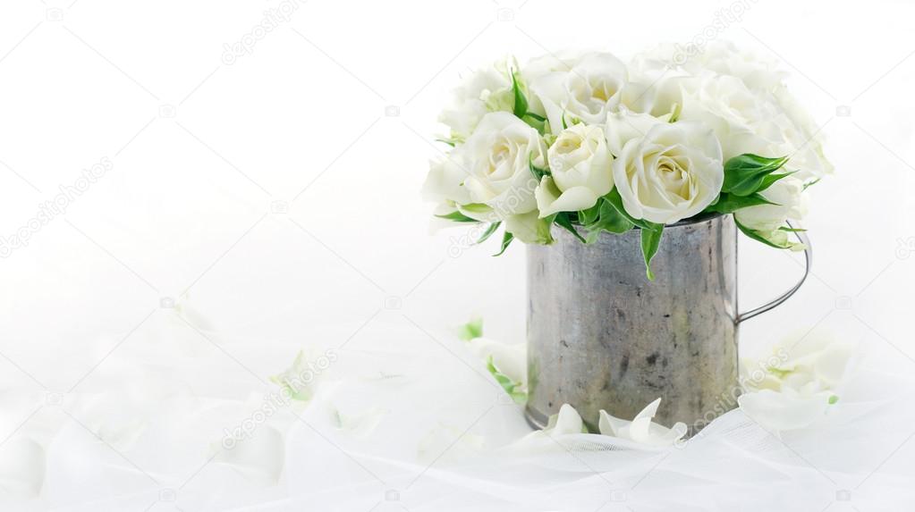 White wedding roses with copy space