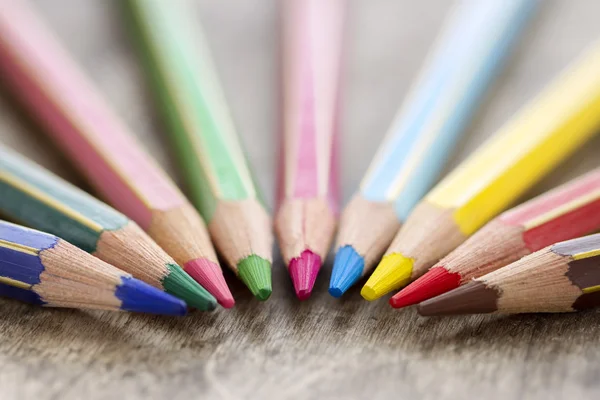 Colorful wooden color pencils on rustic background — Stock Photo, Image