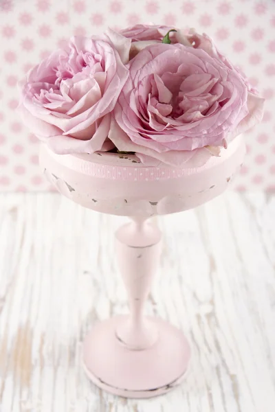 Pink roses in a wooden pastel color vase — Stock Photo, Image