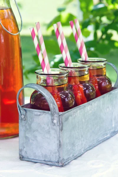 Strawberry juice with striped straws — Stock Photo, Image