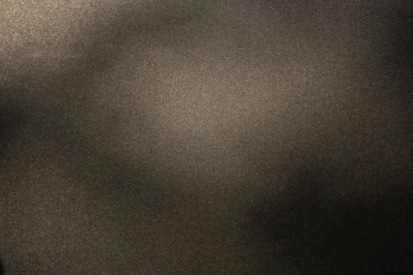 Texture grunge de fond métallique noir avec des miettes abrasives à la surface. Spots lumineux et ombres — Photo