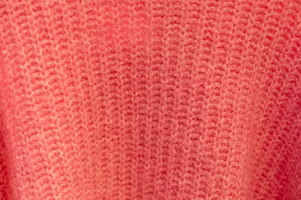 Nahaufnahme der Strickstruktur eines dicken roten Pullovers. Wollfäden — Stockfoto