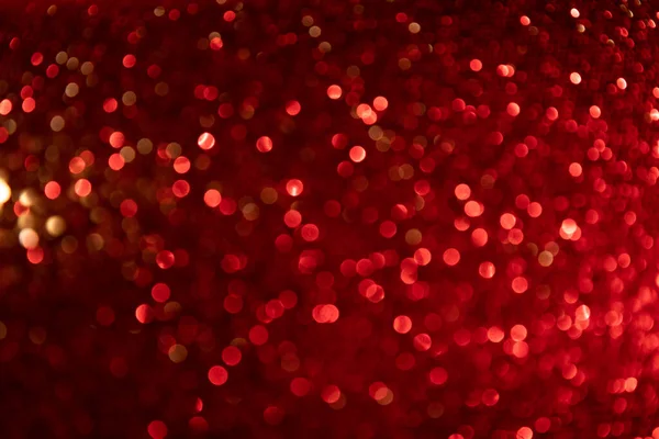 Röd med guld festlig bakgrund. Bokeh från ljuset. Futuristiskt glittrande i rymden. — Stockfoto