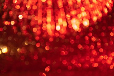 Kırmızı, altın sarısı, şenlikli. Işıktan Bokeh. Uzayda fütürist ışıltı.