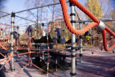 Childrens playground area. Rope devices for climbing. Park urban area