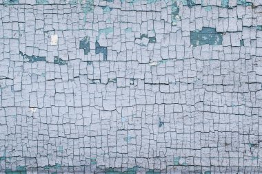 Kırık mavi boyalı ahşap bir yüzey.