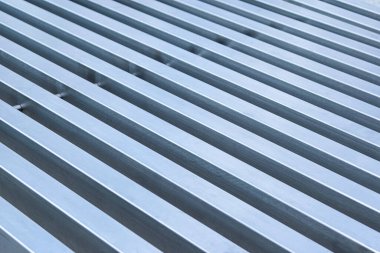rows of even metallic gray stripes close-up.