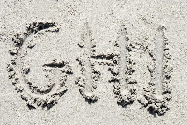 Sand beach alphabet: letters G, H, and I — Stock Photo, Image