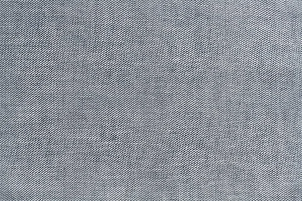 斜纹棉织物是蓝色的 织物的质地是可见的 免版税图库照片