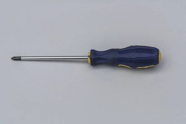 Repair Phillips Screwdriver Blue Handle Close Gray Background Top View — 图库照片